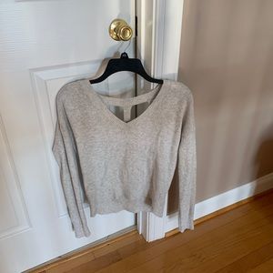 Short sweater with cut out back